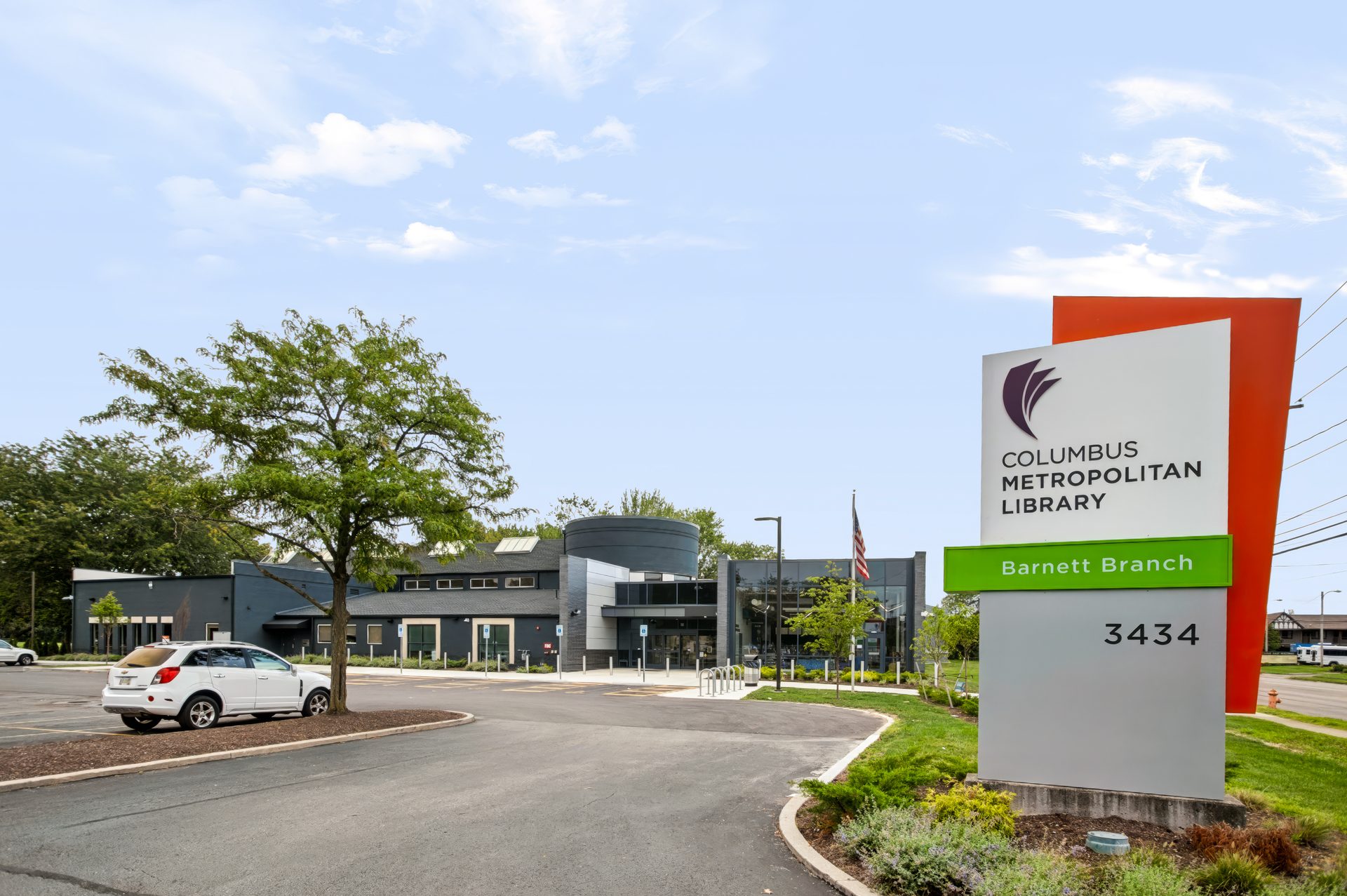 Columbus Metropolitan Library Barnett Branch sign at 3434 E. Livingston Ave with the expanded library behind it