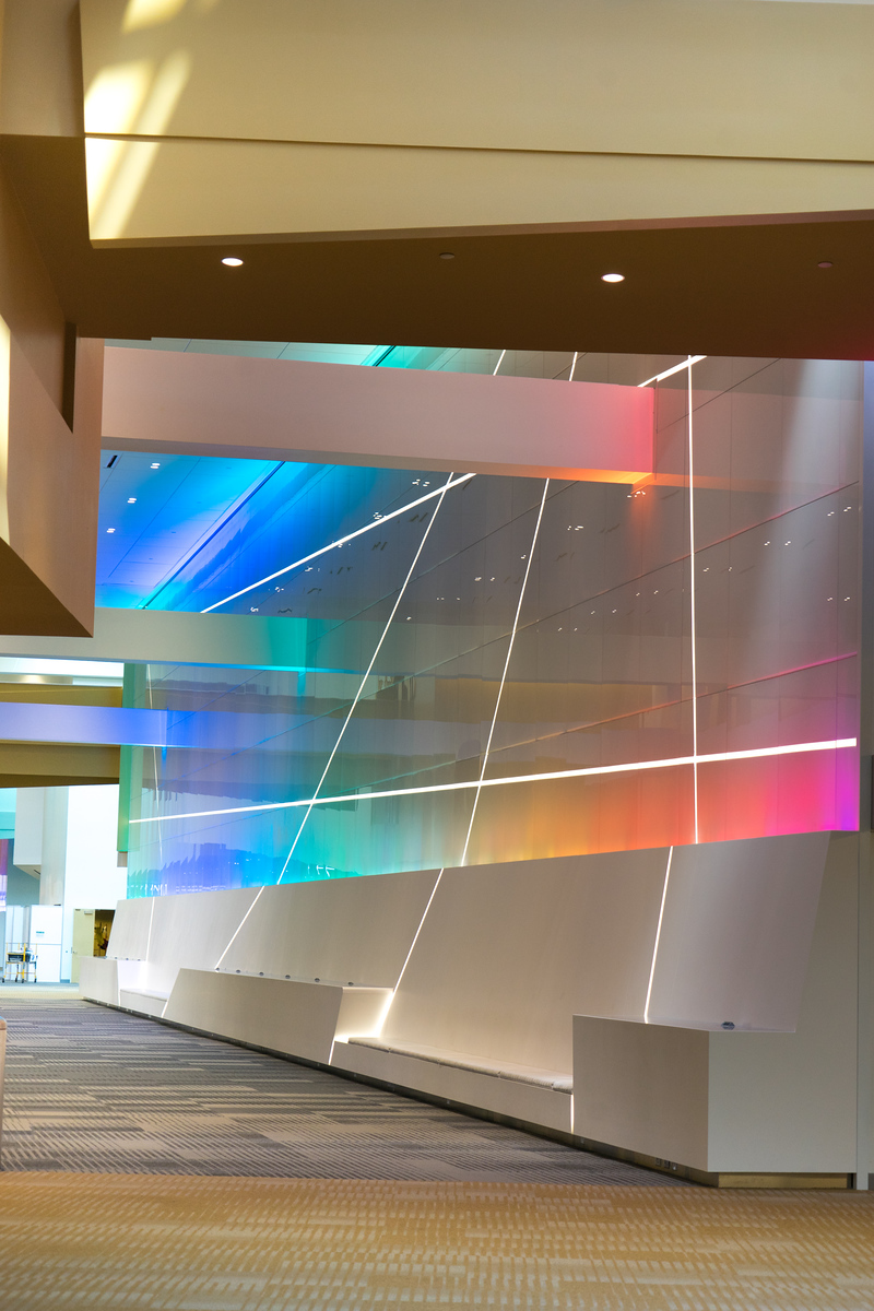 Columbus Convention Center node wall seating Back painted glass node wall rising above built-in concourse seating at the Greater Columbus Convention Center