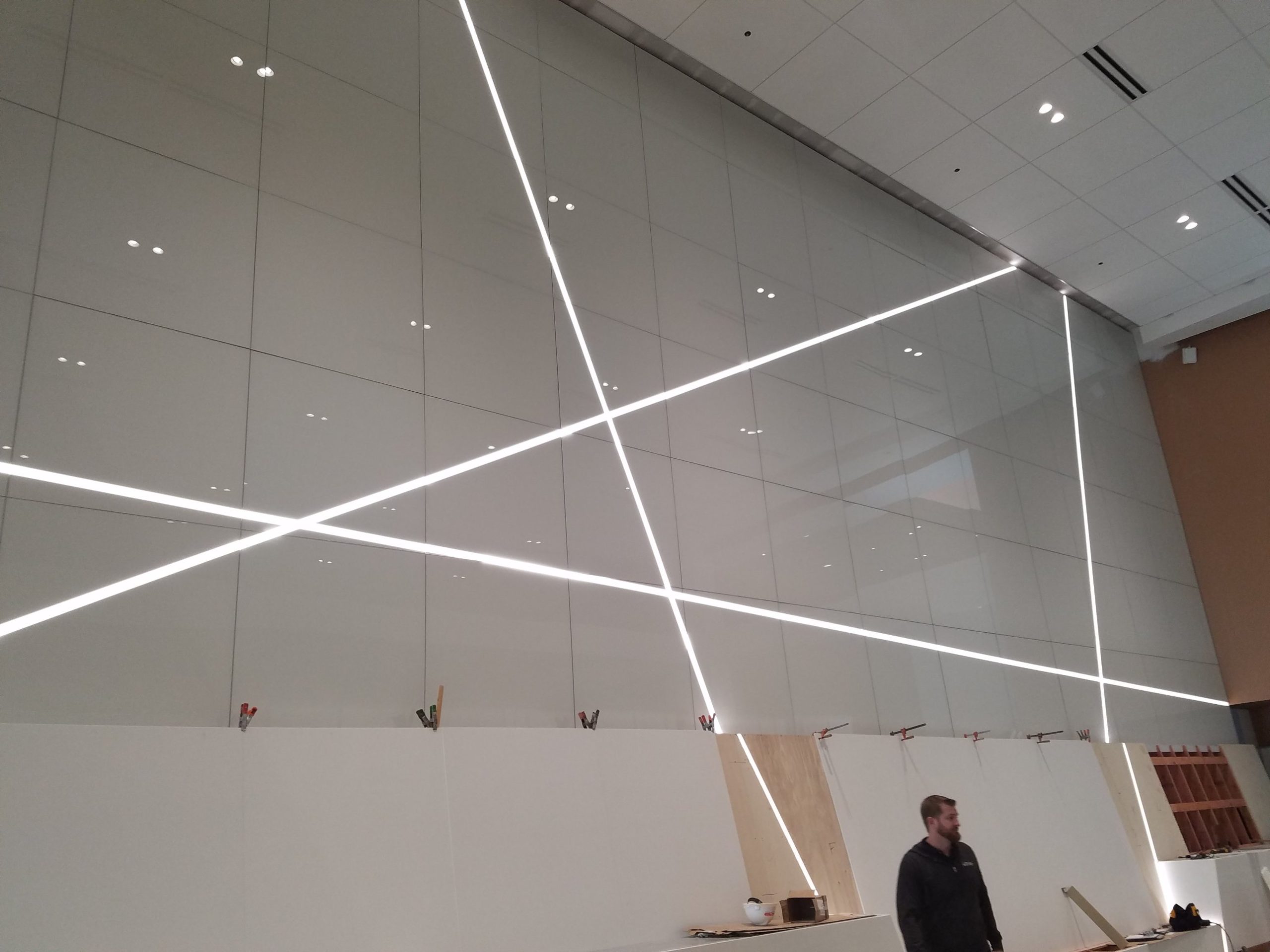 Node wall LED lines lit Back painted glass node wall at the Columbus Convention Center with the diagonal LED light lines switched on during construction
