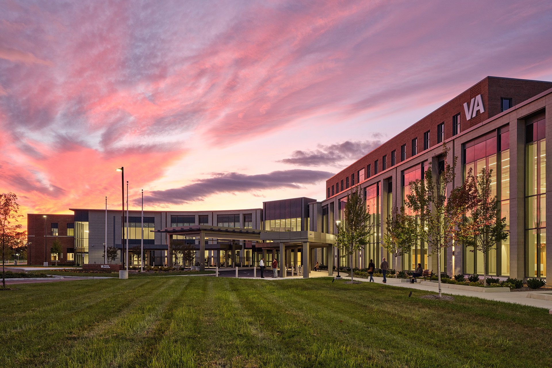 Fredericksburg VA Health Care Center main entrance, Tubelite 400 Series curtain wall with Assa Abloy SL500 sliding entrances Fredericksburg VA Health Care Center main entrance at dusk: two-story Tubelite 400 Series curtain wall with Assa Abloy SL500 sliding entrances in the vestibule