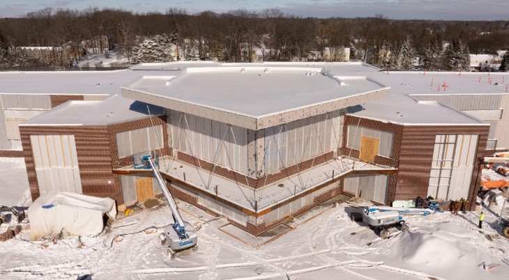 Sheiko Elementary under construction, entry bay wrapped Aerial view of Sheiko Elementary School under construction in winter with the two-story entry glazing bay wrapped. Special-Lite doors and Tubelite framing shop drawings by MP Drafting.